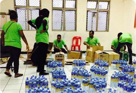 Volunteers organising water bottles