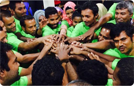 Volunteers joining hands